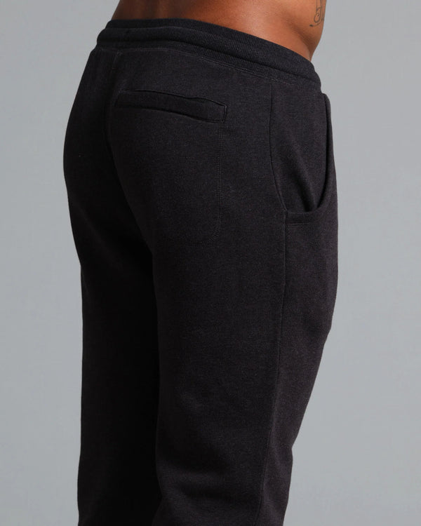 Black sweatpants on a gray background