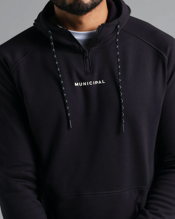 Black hoodie with 'MUNICIPAL' text on a gray background
