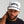 Man wearing a white cap with 'MUNICIPAL' text on a gray background