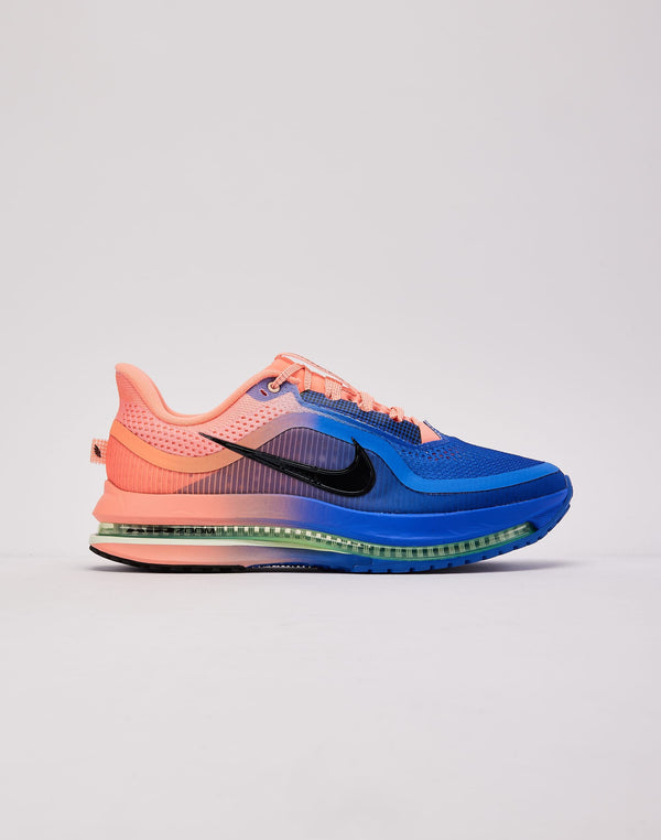 Pink and blue running shoe on a neutral background