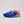 Pink and blue running shoe on a neutral background