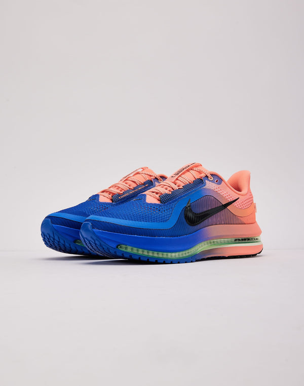 Pink and blue running shoe on a neutral background