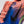 Pink and blue running shoe on a neutral background