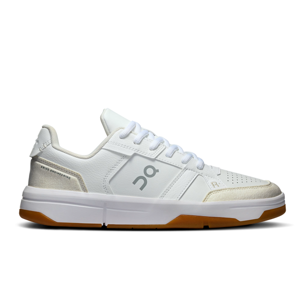 White sneaker with brown sole on a white background