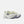 A pair of New Balance running shoes in a light cream and pale yellow-green colorway, featuring dark gray 'N' logos and textured gray soles, set against a plain light gray background.