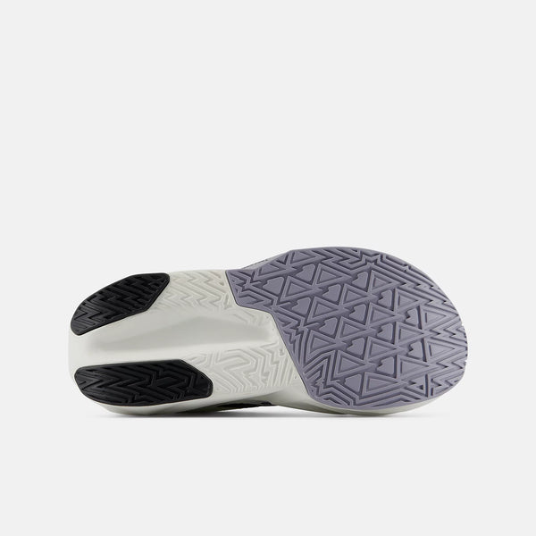 The outsole of a sneaker shown from a side profile view, featuring a white and gray geometric tread pattern with black rubber sections on a light gray background.