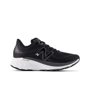 A pair of black New Balance 860V13 sneakers for kids with a mesh upper and a synthetic sole.