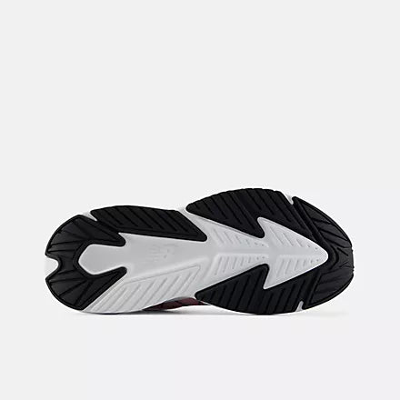 Pink, white, and black shoe on a white background