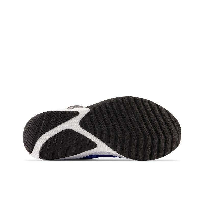 The outsole of the Reveal V4 from NB for Kid's has a lateral ribs for traction