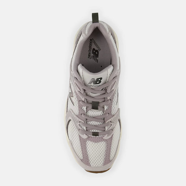 Gray sneaker with New Balance logo on a white background