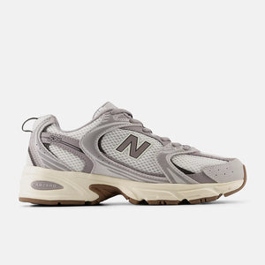 Gray sneaker with New Balance logo on a white background