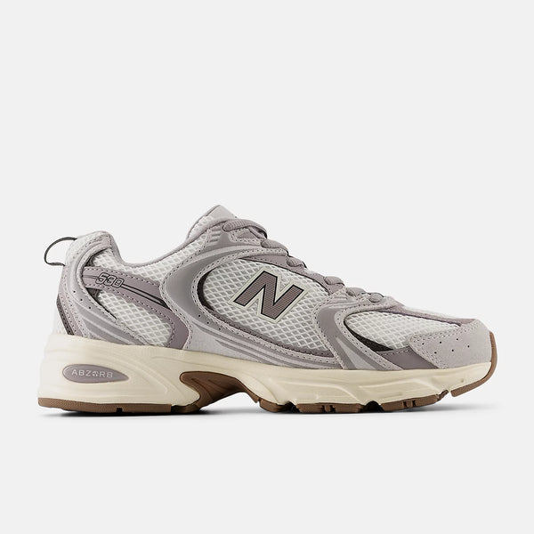 Gray sneaker with New Balance logo on a white background