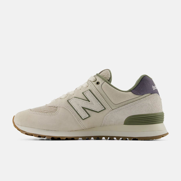 Beige sneaker with green accents on a white background