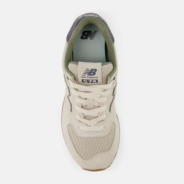 Beige sneaker with New Balance logo on a white background