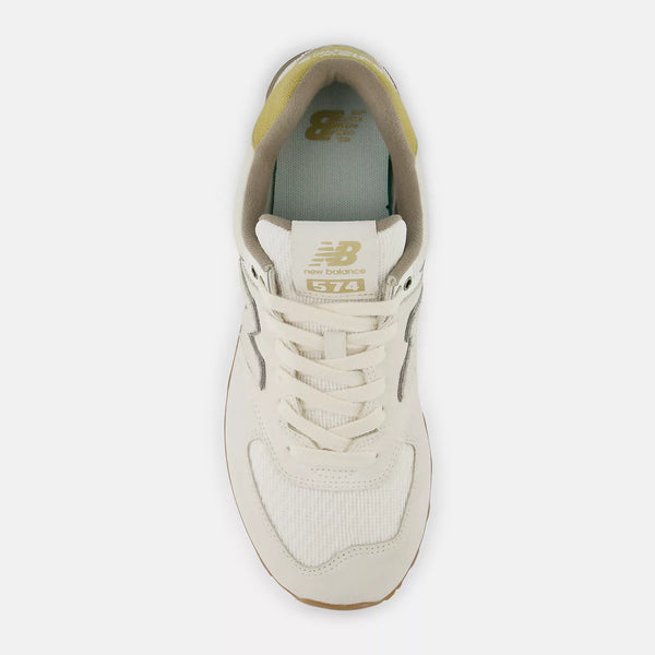 Beige sneaker with brand logo on a white background