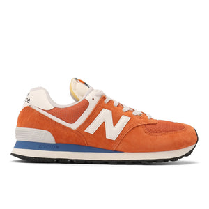 An orange and white New Balance sneaker with blue accents on the sole.