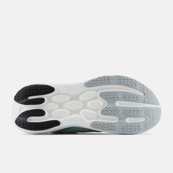 Close-up of a shoe sole with black, white, and gray design on a white background