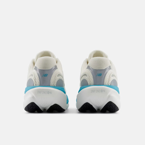Pair of white and gray sneakers with blue accents on a white background
