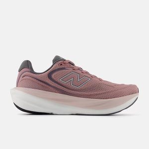 Pink running shoe with New Balance logo on a white background