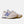 Pair of light pink sneakers with purple accents on a white background