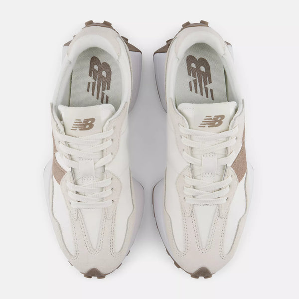 Pair of white sneakers with brown accents on a white background
