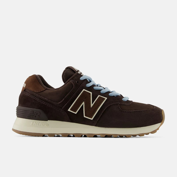 Brown and black women's New Balance sneaker with white logo on a light gray background.