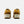 A pair of New Balance 574 sneakers in a mustard yellow and beige colorway,  on a light gray background.