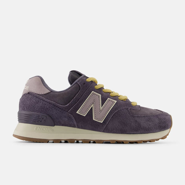 Mostly navy with a hint of purple sneaker with yellow accents on a white background