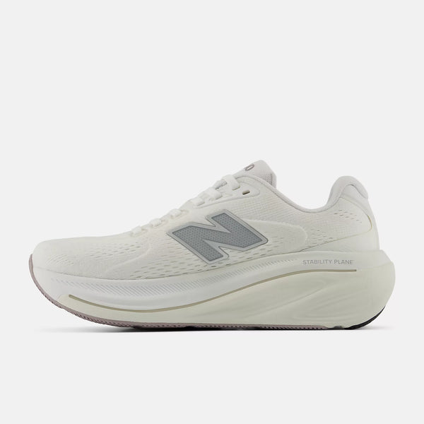 White running shoe with New Balance logo on a light gray background