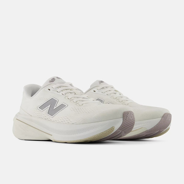 Pair of light gray running shoes on a white background