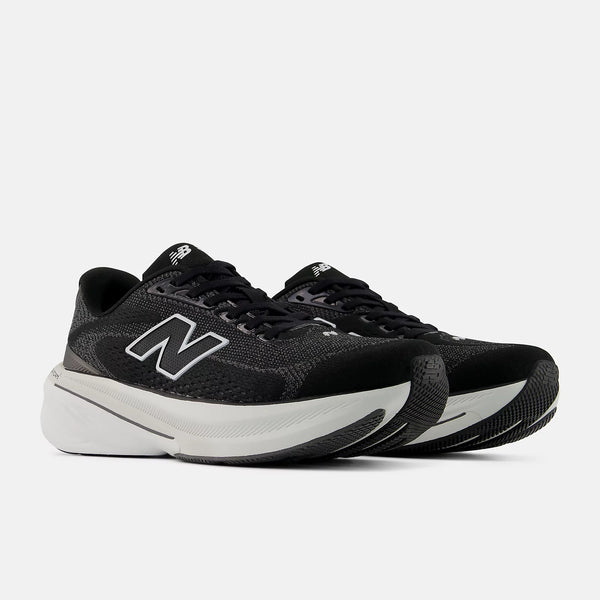 Black Women's New Balance running shoes with white soles on a light gray background