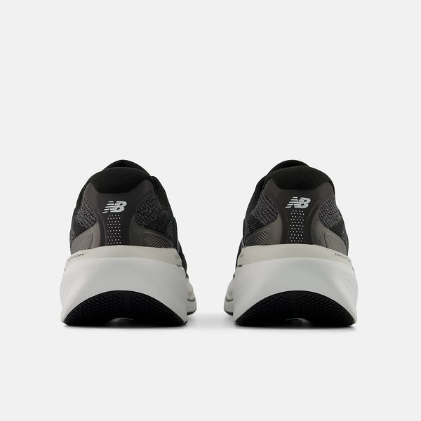 Black running shoes with white soles on a white background