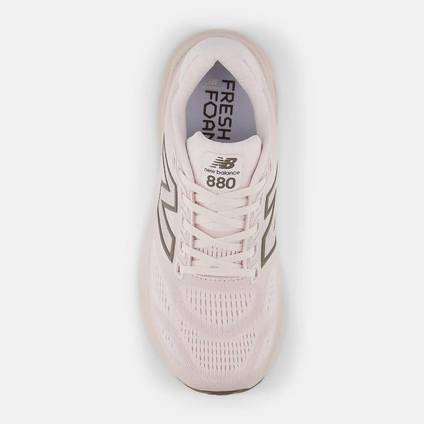 Pink New Balance 880 sneaker on a white background