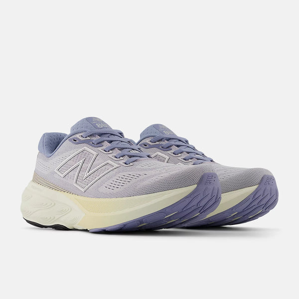 Gray and purple running shoe on a white background