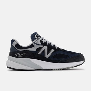 Navy and gray sneaker with New Balance logo on a white background