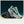 Gray running shoes with green accents on a gradient background
