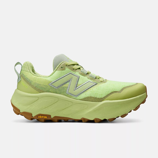 Green running shoe with brand logo on a white background
