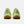Green sneakers with brown soles on a white background