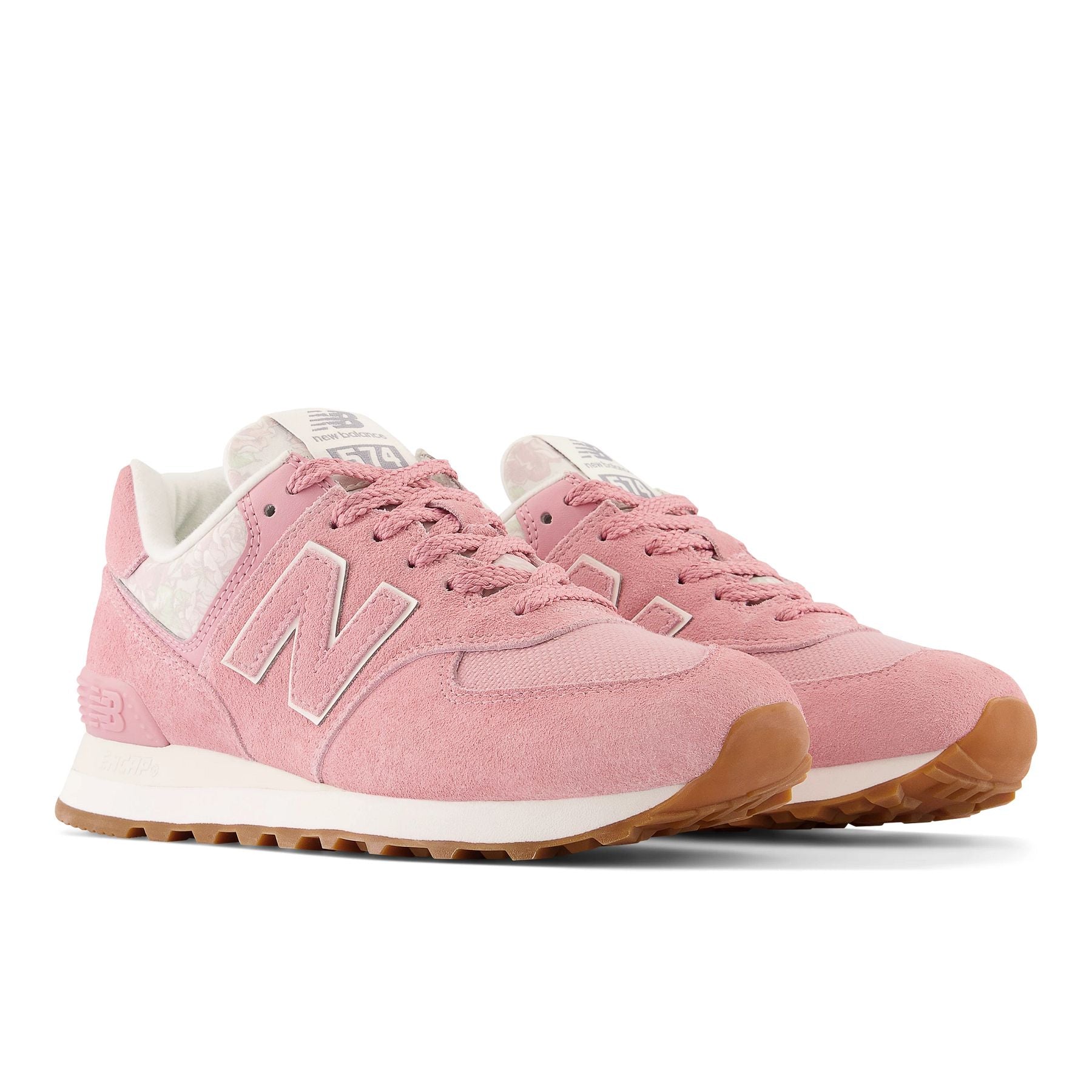 Front angle view of the Women's New Balance 574 lifestyle in the color Heavenly Rose