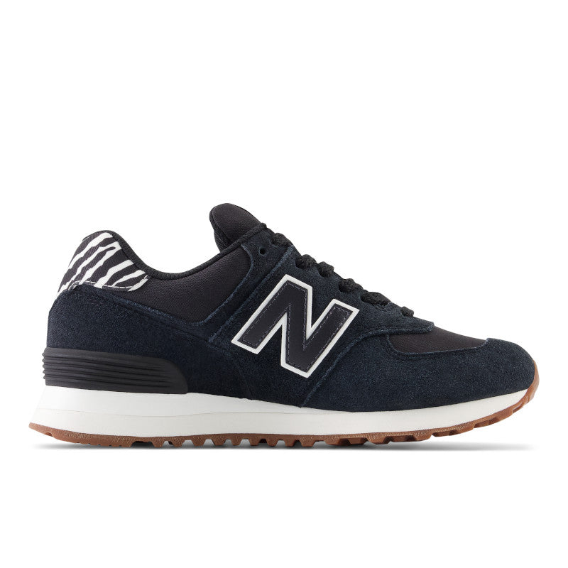 These NB 574 lifestyle shoes have a Black N logo on the lateral side with a white outline