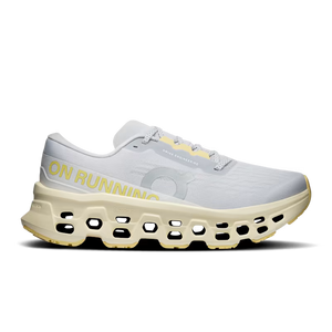 White and grey running shoe with yellow accents on a white background