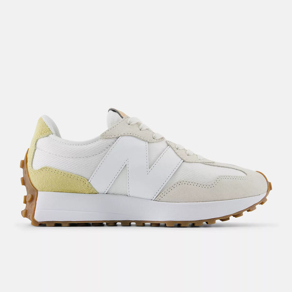 White and beige sneaker with New Balance logo on a white background