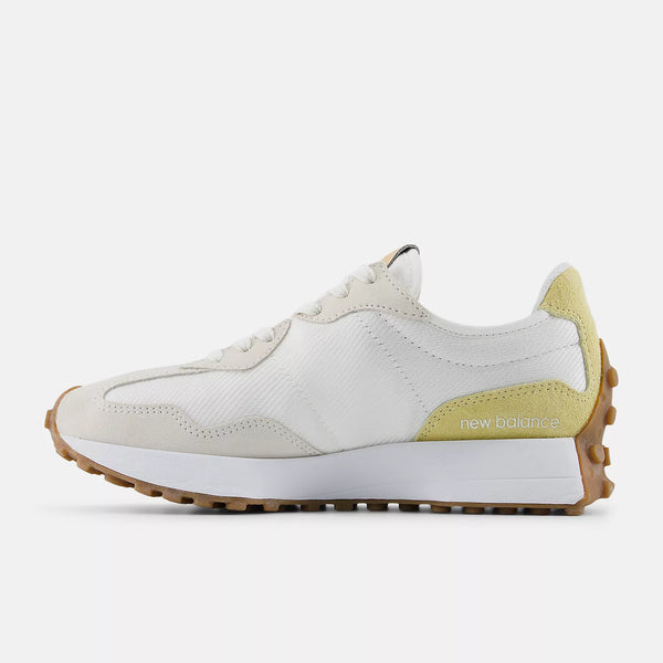 White and beige sneaker with New Balance logo on a white background