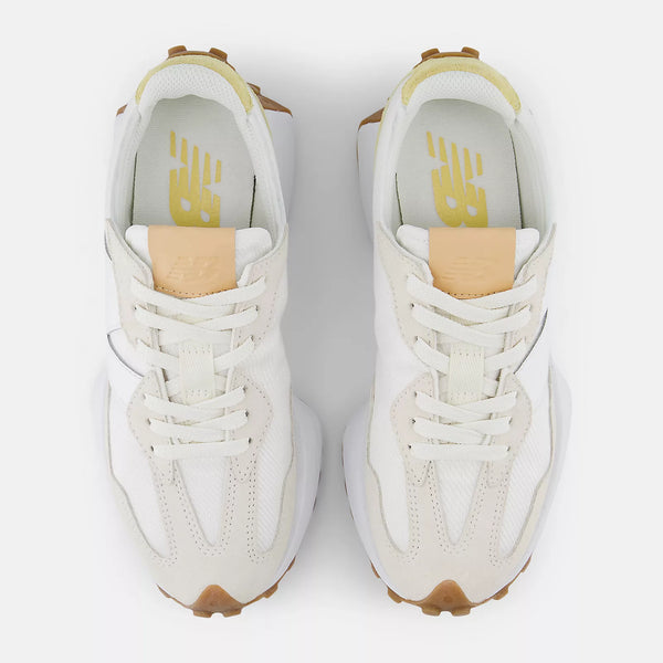 White and beige sneaker with New Balance logo on a white background