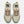 A pair of New Balance shoes with teh wording heirro across the top of the tongue.