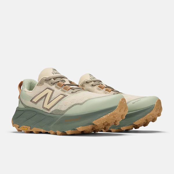 Pair of green and brown running shoes on a white background