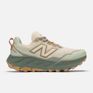 Green and beige running shoe with New Balance logo on a white background