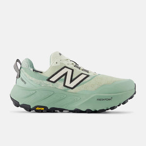 Green running shoe with New Balance logo on a white background