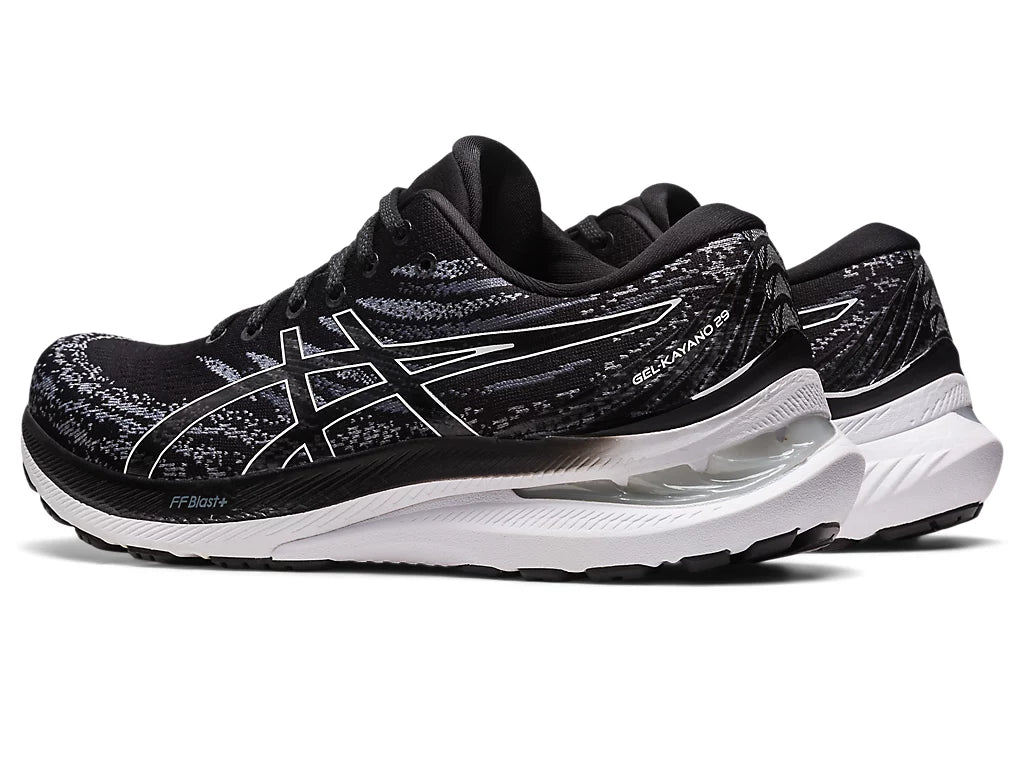 Back angled view of the Women's Gel Kayano 29 in the wide "D" width in the color Black/White