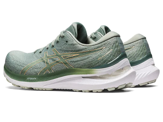Back angled view of the Women's Kayano 29 by ASIC in the color Slate Grey / Champagne